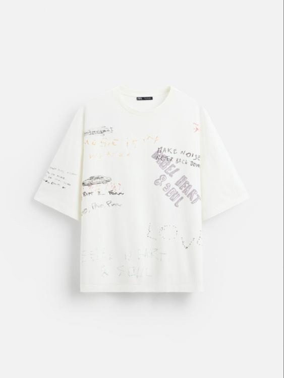 REMERA LAVADA GRAFICOS BLANCO ROTO